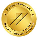 Illustration of gold coin with The Joint Commission logo on it